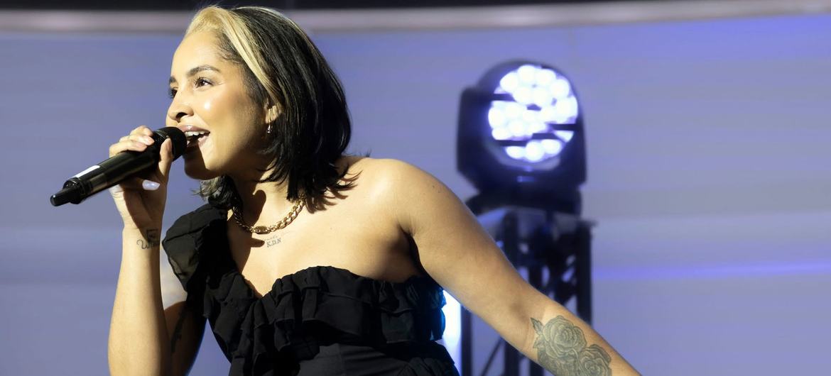 Ocevne warming up the room at the Stand Up for Social Justice event.